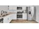 Modern kitchen featuring stainless steel appliances, granite countertops, and white cabinets at 208 Kirkland St, Goose Creek, SC 29445