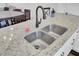 Close-up of a granite countertop with a stainless steel sink and modern faucet at 208 Kirkland St, Goose Creek, SC 29445