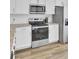 Bright kitchen featuring stainless steel appliances, granite countertops and white cabinets at 208 Kirkland St, Goose Creek, SC 29445