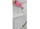 Bright laundry room with side-by-side washer and dryer and wire shelving at 208 Kirkland St, Goose Creek, SC 29445
