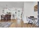 Open-concept living area with hardwood floors, dining table, and a bright, airy atmosphere at 208 Kirkland St, Goose Creek, SC 29445