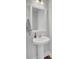 Clean powder room with pedestal sink, modern faucet, and neutral wall color at 208 Kirkland St, Goose Creek, SC 29445