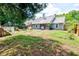 Spacious backyard featuring a fire pit, wood chairs, and an above-ground pool at 209 Apache Dr, Summerville, SC 29483