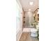 Modern bathroom with glass enclosed shower with tile surround, toilet, and shelves at 209 Apache Dr, Summerville, SC 29483