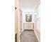 Bright bathroom vanity with marble countertop, neutral paint, large mirror and modern lighting at 209 Apache Dr, Summerville, SC 29483