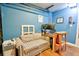 Finished bonus room decorated with blue paint including a desk, seating, and accessories at 209 Apache Dr, Summerville, SC 29483