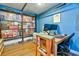 Finished bonus room decorated with license plates and signs including a desk and seating at 209 Apache Dr, Summerville, SC 29483