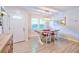Dining area featuring tile floors and a pendant light above a wood and white table at 209 Apache Dr, Summerville, SC 29483