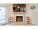 Elegant fireplace features white tile surround, a wood mantel, and contemporary design at 209 Apache Dr, Summerville, SC 29483