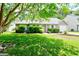 Beautiful home featuring a well-manicured lawn, lush landscaping, and inviting curb appeal at 209 Apache Dr, Summerville, SC 29483