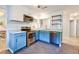 Modern kitchen featuring stainless steel appliances, blue cabinets and white countertops at 209 Apache Dr, Summerville, SC 29483