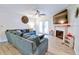 Comfortable living room with a ceiling fan, fireplace and large screen television at 209 Apache Dr, Summerville, SC 29483