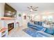 Spacious living room features a ceiling fan, brick fireplace, and comfortable seating at 209 Apache Dr, Summerville, SC 29483