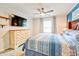 Comfortable main bedroom with white dresser, ceiling fan and laminate flooring and TV at 209 Apache Dr, Summerville, SC 29483