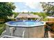 Above-ground pool in a well-maintained backyard, perfect for summer enjoyment at 209 Apache Dr, Summerville, SC 29483