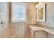Bathroom featuring granite countertop vanity and stone walls at 21 Rivers Point Row # 17G, Charleston, SC 29412
