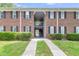 Close-up of brick apartment building showing a pathway and central staircase at 21 Rivers Point Row # 17G, Charleston, SC 29412
