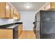 Bright kitchen featuring wooden cabinets, granite countertops, and modern appliances at 21 Rivers Point Row # 17G, Charleston, SC 29412