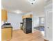 Well-lit kitchen features wooden cabinets, dark countertops, and appliances at 21 Rivers Point Row # 17G, Charleston, SC 29412
