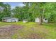 House backyard with small sheds and green space at 2202 Sc-61, Ridgeville, SC 29472