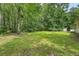 View of the spacious backyard and adjacent wooded area at 2202 Sc-61, Ridgeville, SC 29472