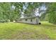 View of the large backyard, showcasing the home's exterior and peaceful surroundings at 2202 Sc-61, Ridgeville, SC 29472