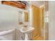 A simple bathroom featuring a white toilet, pedestal sink, and shower at 2202 Sc-61, Ridgeville, SC 29472