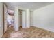 Bright bedroom with a connecting bathroom and closet featuring light colored wood-look flooring at 2202 Sc-61, Ridgeville, SC 29472