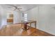 Open dining room with a ceiling fan and a view into the kitchen with lots of natural light at 2202 Sc-61, Ridgeville, SC 29472