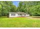Quaint one-story house with inviting porch swing and neatly trimmed lawn at 2202 Sc-61, Ridgeville, SC 29472