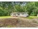 Quaint single-story house with an inviting covered porch and surrounded by mature trees at 2202 Sc-61, Ridgeville, SC 29472