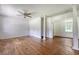 Bright living room featuring hardwood floors, white columns, and a window offering natural light at 2202 Sc-61, Ridgeville, SC 29472