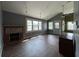 Inviting living room with a fireplace, large windows for natural light, and hard wood floors at 2204 Dover St, North Charleston, SC 29405