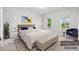 Bedroom virtually staged with a bed, bench, chair, and decor at 226 Clydesdale Cir, Summerville, SC 29486