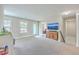 Large bonus room with plush carpeting, natural light, and a TV for entertainment at 2336 Brinkley Rd, Johns Island, SC 29455