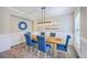 Beautiful dining room featuring a wooden table, blue chairs, and modern light fixture at 2336 Brinkley Rd, Johns Island, SC 29455