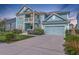 Lovely two-story home features a two-car garage, second-floor porch, and manicured landscaping at 2336 Brinkley Rd, Johns Island, SC 29455