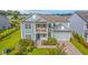 Charming two-story home with a balcony, lush landscaping, and attached two-car garage at 2336 Brinkley Rd, Johns Island, SC 29455