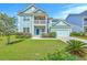 Charming two-story home with a blue front door, a covered porch, well-kept lawn, and an attached garage at 2336 Brinkley Rd, Johns Island, SC 29455