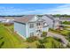 Beautiful two-story home with blue siding, a balcony, well-manicured lawn, and an attached garage at 2336 Brinkley Rd, Johns Island, SC 29455