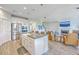 Open floor plan with a kitchen featuring a large island and stainless steel appliances flowing into the living area at 2336 Brinkley Rd, Johns Island, SC 29455