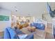 Spacious living room boasts modern furnishings and an open floor plan with beautiful light fixtures at 2336 Brinkley Rd, Johns Island, SC 29455