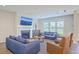Cozy living room featuring comfortable seating, a fireplace with mounted television, and natural light at 2336 Brinkley Rd, Johns Island, SC 29455