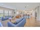 Open-concept living room featuring stylish sofas, chairs, and seamless flow to the modern kitchen at 2336 Brinkley Rd, Johns Island, SC 29455