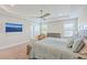 Bright main bedroom featuring a tray ceiling, ample natural light and TV at 2336 Brinkley Rd, Johns Island, SC 29455