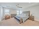 Relaxing main bedroom featuring a tray ceiling, a ceiling fan, and lots of natural light at 2336 Brinkley Rd, Johns Island, SC 29455