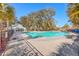 Community pool surrounded by palm trees and a pavilion with ample seating; an ideal spot for relaxation at 2336 Brinkley Rd, Johns Island, SC 29455