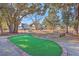 Scenic putting green surrounded by mature trees in a tranquil community park setting at 2336 Brinkley Rd, Johns Island, SC 29455