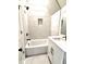 Bright bathroom featuring a shower and bathtub combination with tile backsplash at 25 Nats Ct, Charleston, SC 29403
