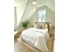 Bright bedroom featuring a ceiling fan, wood floors, and a sloped ceiling at 25 Nats Ct, Charleston, SC 29403